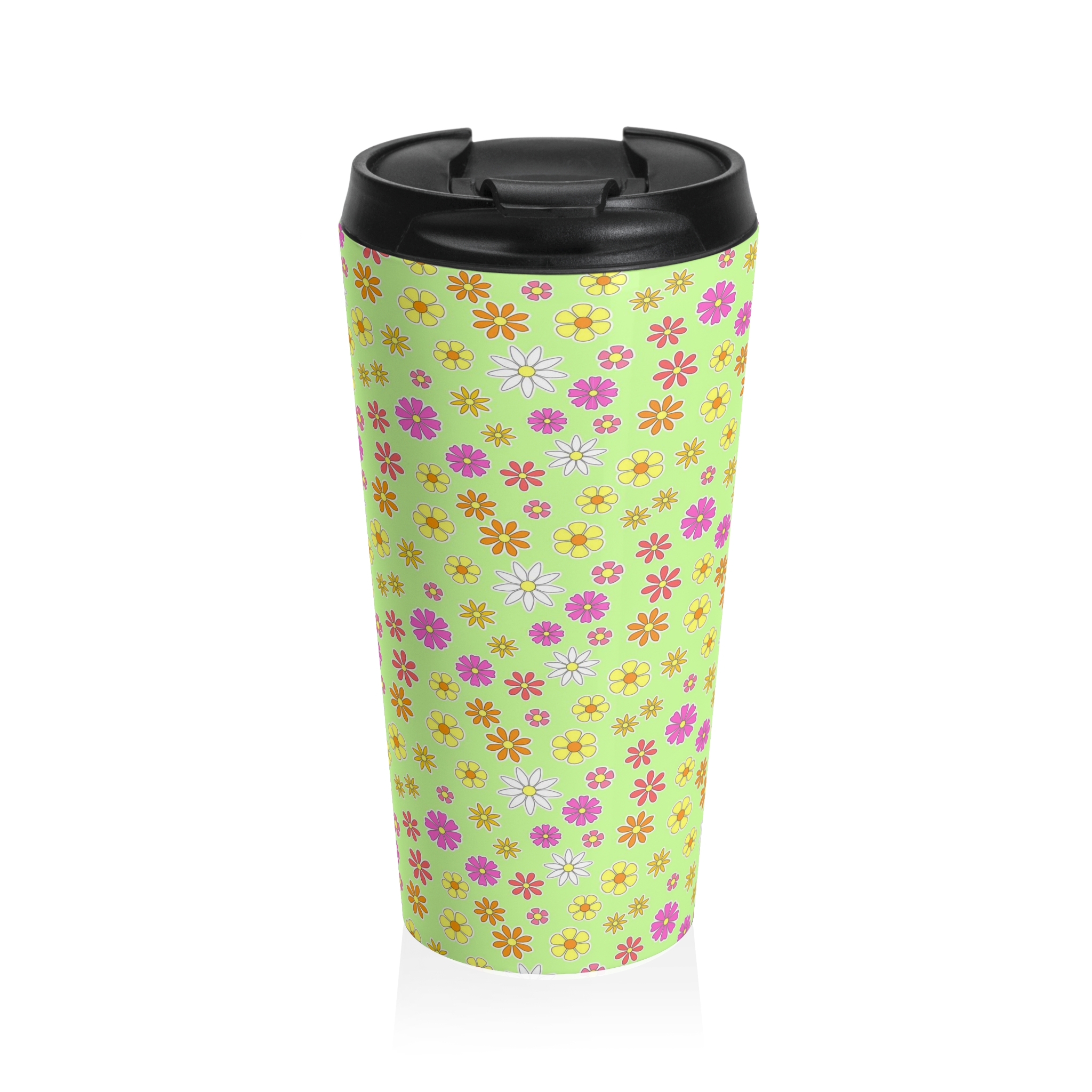 a green travel mug with flower print
